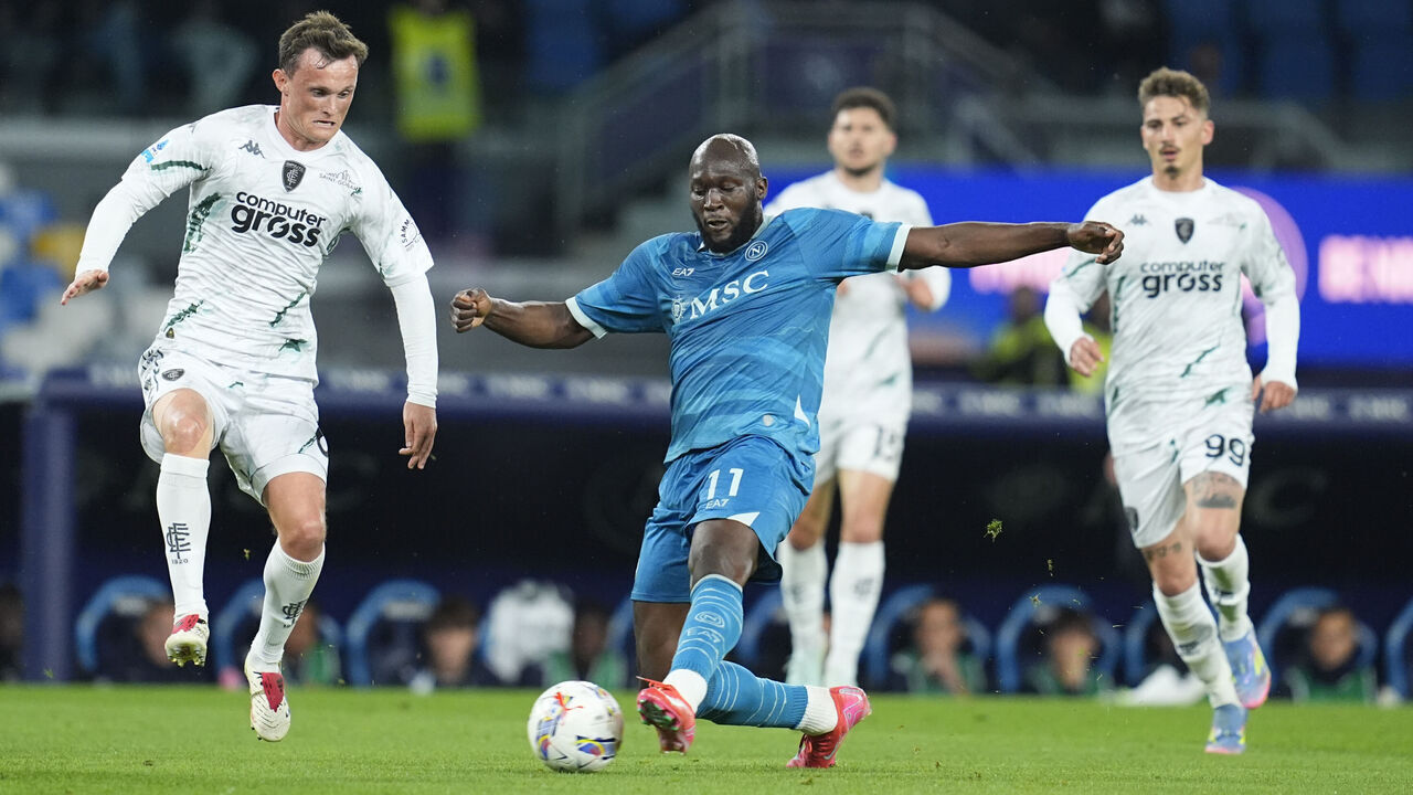 Naples, Italy - April 14: Liam Henderson of Empoli FC and Romelu Lukaku of SSC Napoli battle for the ball during the Serie A match between SSC Napoli and Empoli FC at Diego Maradona Stadium on April 14, 2025 in Naples, Italy.