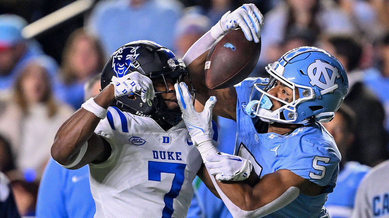 CHAPEL HILL, NORTH CAROLINA - NOVEMBER 11: J.J. Jones #5 of the North Carolina Tar Heels makes a catch against Al Blades Jr. #7 of the Duke Blue Devils during the first half of the game at Kenan Memorial Stadium on November 11, 2023 in Chapel Hill, North Carolina.