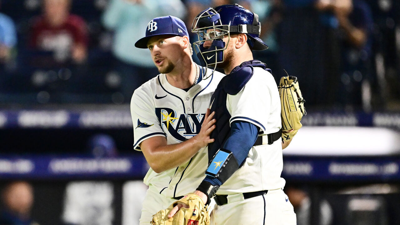 TAMPA, FLORIDA - APRIL 14: Eric Orze #17 and Danny Jansen #19 of the Tampa Bay Rays celebrate after defeating the Boston Red Sox 16-1 at George M. Steinbrenner Field on April 14, 2025 in Tampa, Florida.