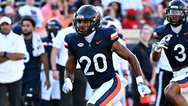 CHARLOTTESVILLE, VIRGINIA - OCTOBER 12, 2024: Jonas Sanker #20 of the Virginia Cavaliers in action during the first half against the Louisville Cardinals at Scott Stadium on October 12, 2024 in Charlottesville, Virginia.