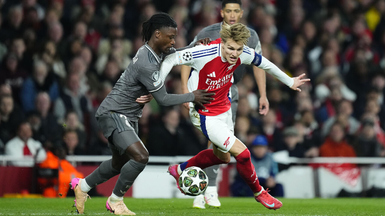 Eduardo Camavinga central midfield of Real Madrid and France and Martin Odegaard attacking midfield of Arsenal and Norway compete for the ball during the UEFA Champions League 2024/25 Quarter Final First Leg match between Arsenal FC and Real Madrid C.F. at Arsenal Stadium on April 8, 2025 in London, England.