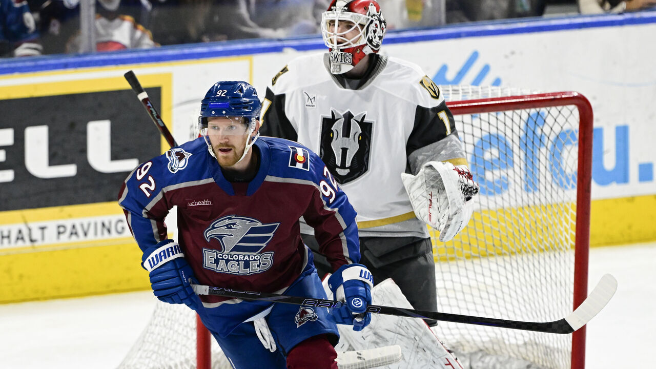 LOVELAND, CO - APRIL 11: Colorado Eagles forward Gabriel Landeskog (92), left, skates in front of Henderson Silver Knights goalie Cameron Whitehead (1) in the third period at Blue Arena in Loveland, Colorado on Friday, April 11, 2025.