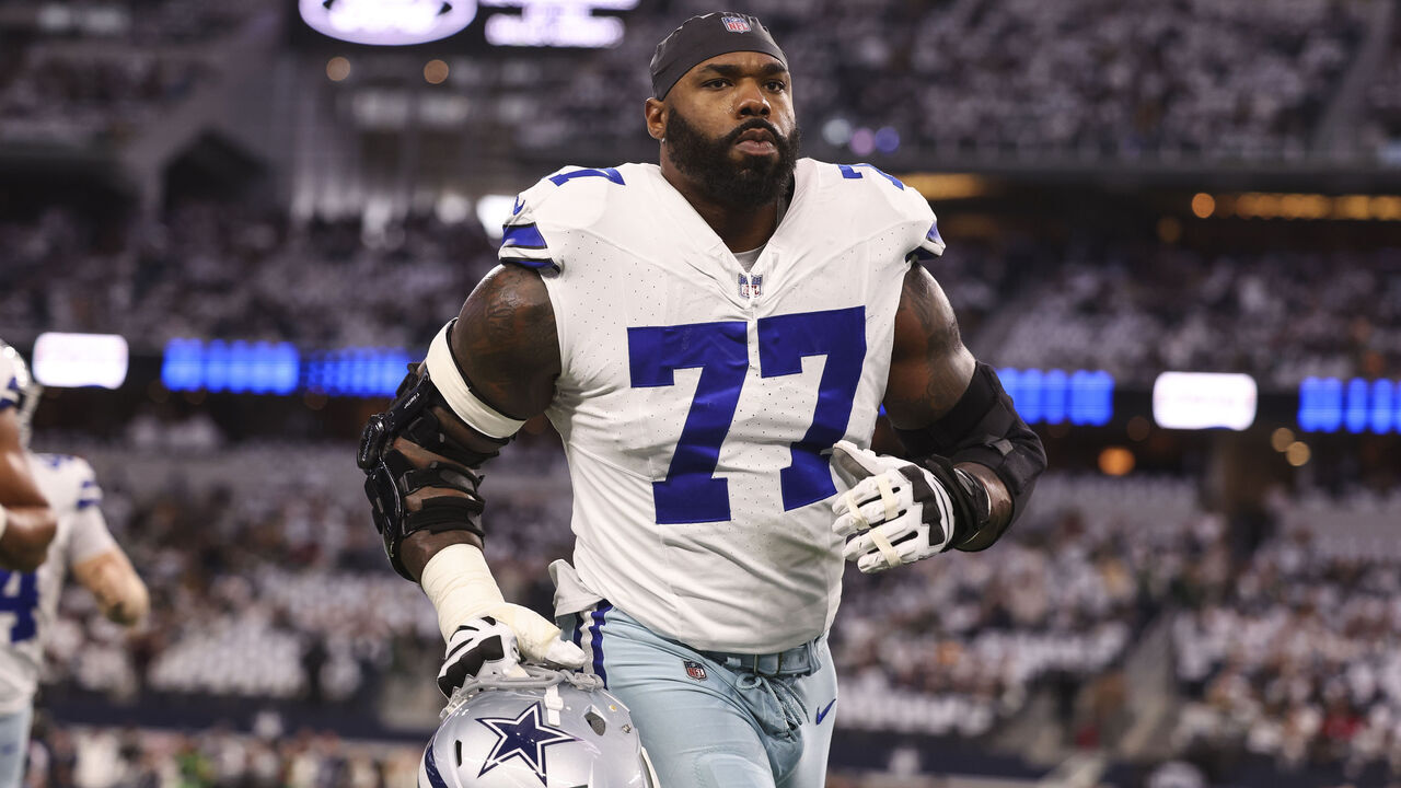 ARLINGTON, TX - JANUARY 14: Tyron Smith #77 of the Dallas Cowboys warms up prior to an NFL wild-card playoff football game against the Green Bay Packers at AT&T Stadium on January 14, 2024 in Arlington, Texas.