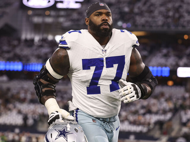 ARLINGTON, TX - JANUARY 14: Tyron Smith #77 of the Dallas Cowboys warms up prior to an NFL wild-card playoff football game against the Green Bay Packers at AT&T Stadium on January 14, 2024 in Arlington, Texas.