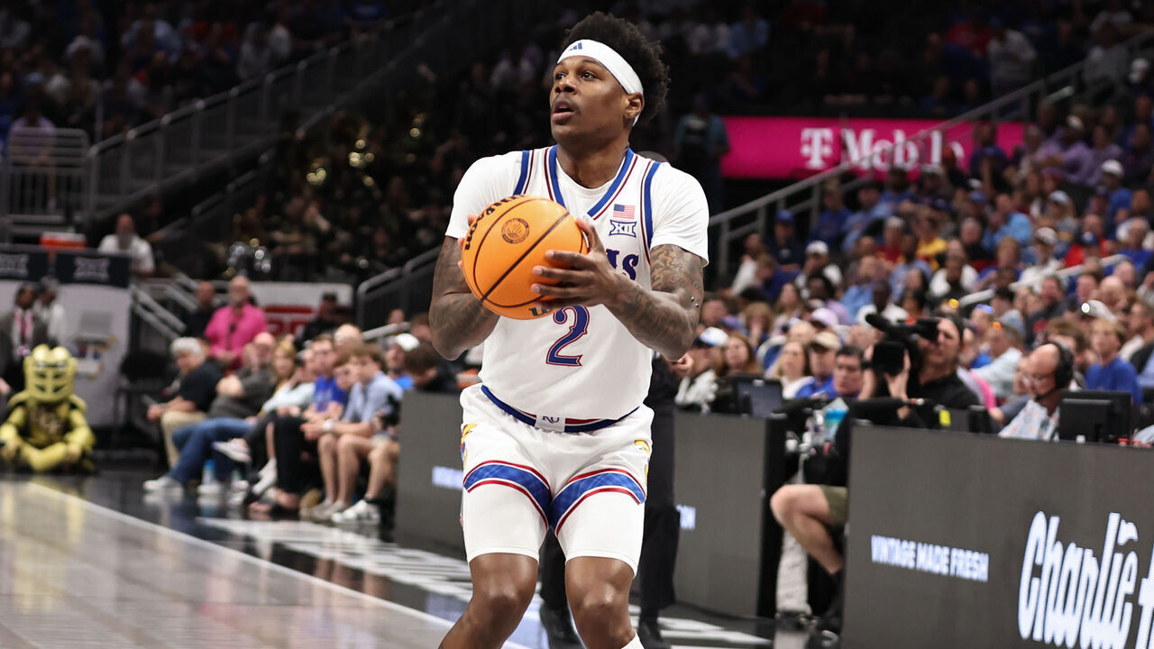 KANSAS CITY, MO - MARCH 12: Kansas Jayhawks guard AJ Storr (2) sets up to shoot a three in the second half of a Big 12 tournament game between the UCF Knights and Kansas Jayhawks on March 12, 2025 at T-Mobile Center in Kansas City, MO.