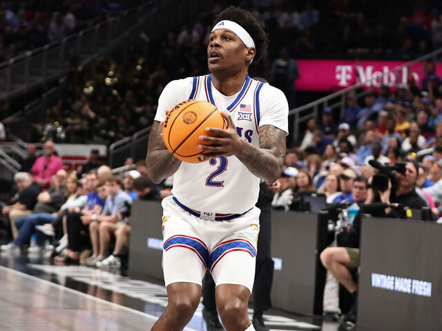 KANSAS CITY, MO - MARCH 12: Kansas Jayhawks guard AJ Storr (2) sets up to shoot a three in the second half of a Big 12 tournament game between the UCF Knights and Kansas Jayhawks on March 12, 2025 at T-Mobile Center in Kansas City, MO.