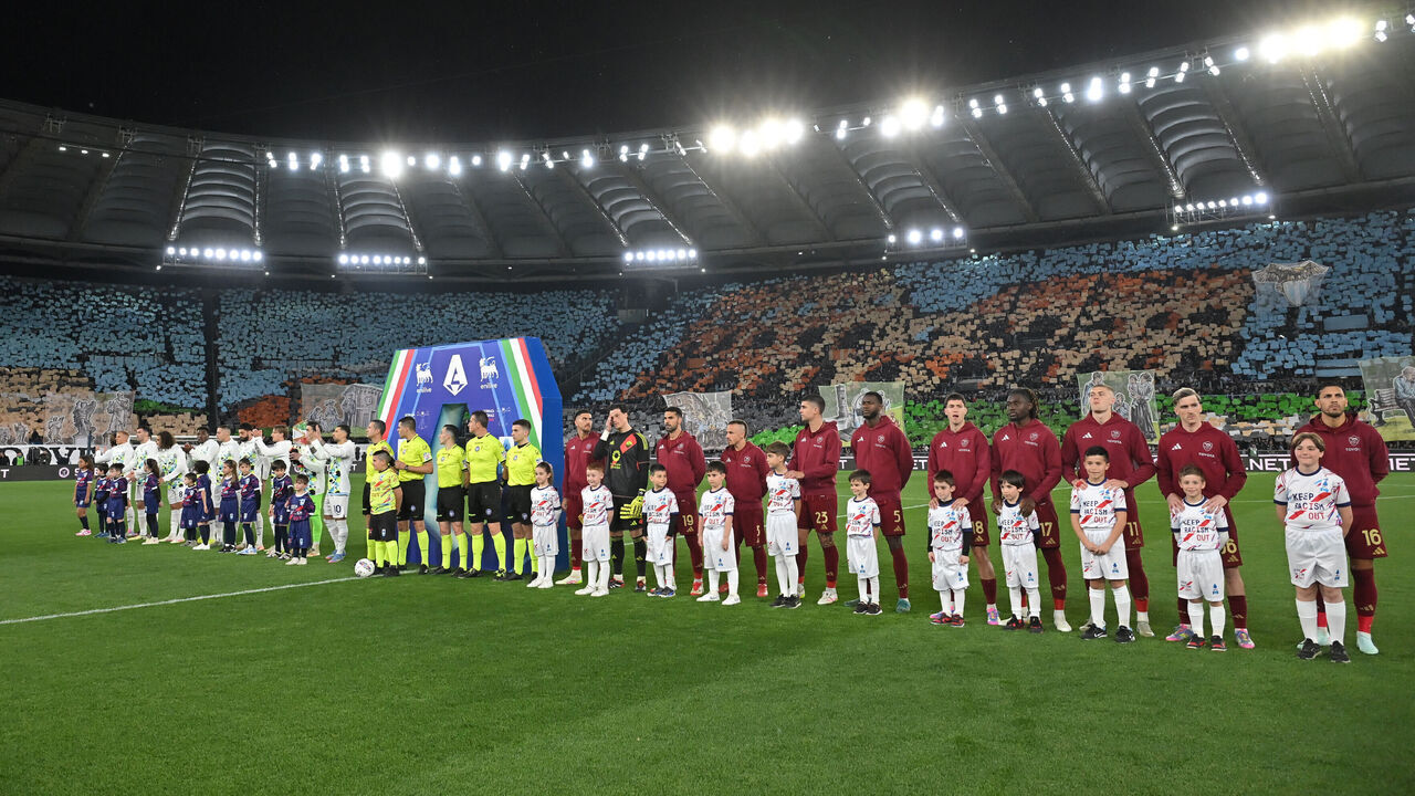 ROME, ITALY - 2025/04/13: Lazio players (L) and Roma players (R) seen in action during the Serie A match between Lazio and Roma at Olympic stadium. Final score; SS Lazio 1: 1 Roma.