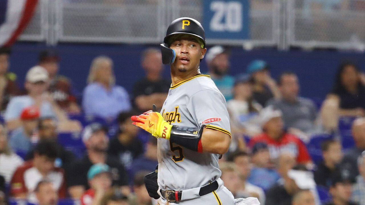 MIAMI, FLORIDA - MARCH 30: Endy Rodriguez #5 of the Pittsburgh Pirates runs home to score against the Miami Marlins in the fifth inning of the game at loanDepot park on March 30, 2025 in Miami, Florida.