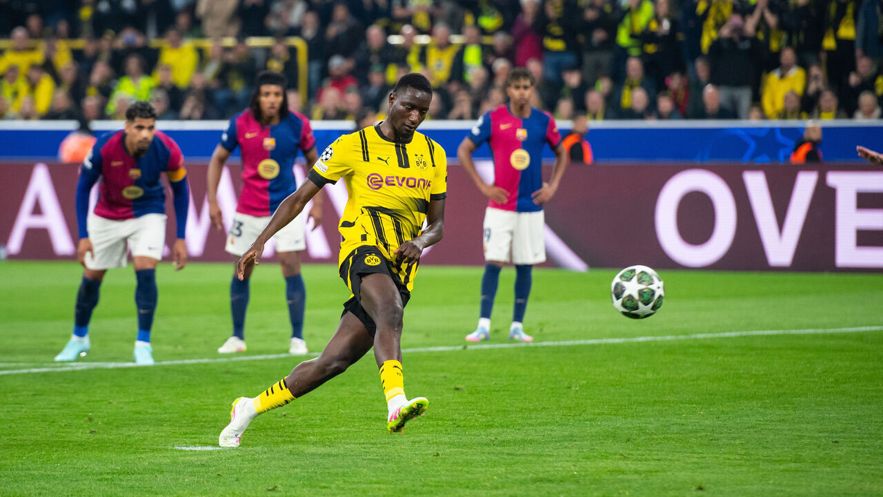 DORTMUND, GERMANY - APRIL 15: Serhou Guirassy of Dortmund scores his team's first goal during the UEFA Champions League quarter-final second leg football match between BVB Borussia Dortmund and FC Barcelona in Dortmund, Germany on April 15, 2025