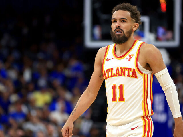 ORLANDO, FLORIDA - APRIL 15: Trae Young #11 of the Atlanta Hawks looks on during the second half of an NBA play-in tournament game against the Orlando Magic at Kia Center on April 15, 2025 in Orlando, Florida.