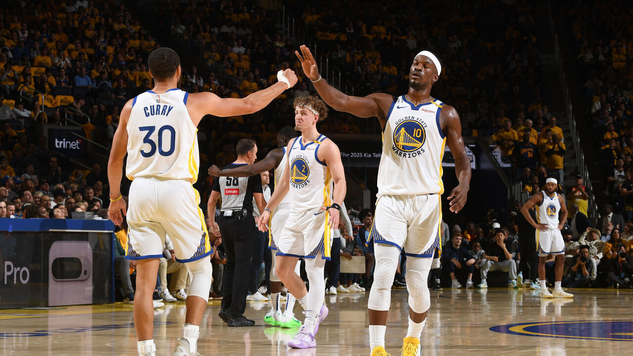 SAN FRANCISCO, CA - APRIL 15: Stephen Curry #30 and Jimmy Butler #10 of the Golden State Warriors high five during the game against the Memphis Grizzlies during the 2025 SoFi Play-In Tournament on April 15, 2025 at Chase Center in San Francisco, California. NOTE TO USER: User expressly acknowledges and agrees that, by downloading and or using this photograph, user is consenting to the terms and conditions of Getty Images License Agreement. Mandatory Copyright Notice: Copyright 2025 NBAE