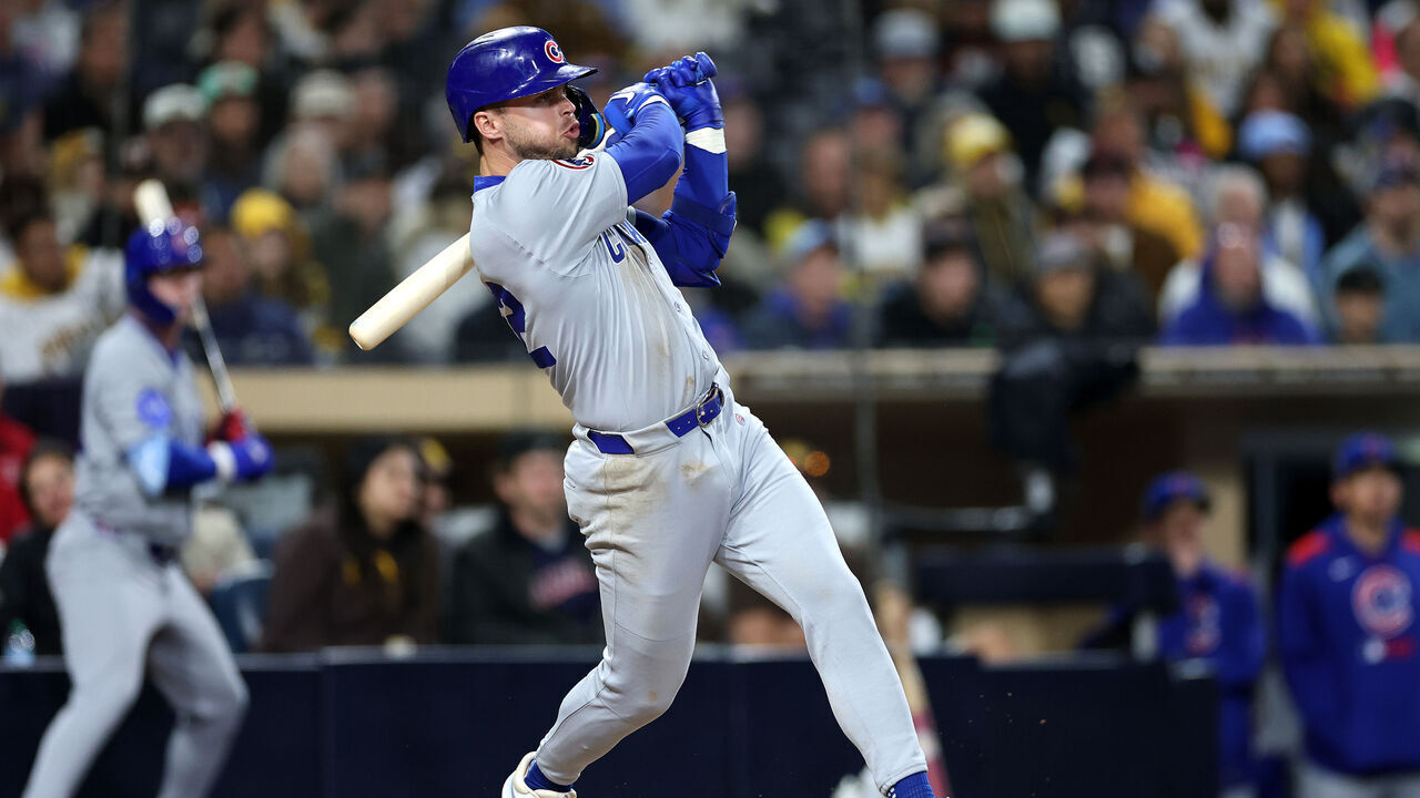 SAN DIEGO, CALIFORNIA - APRIL 15: Nico Hoerner #2 of the Chicago Cubs connects for an RBI triple during the tenth inning of a game against the San Diego Padres at Petco Park on April 15, 2025 in San Diego, California. All players are wearing the number 42 in honor of Jackie Robinson Day.