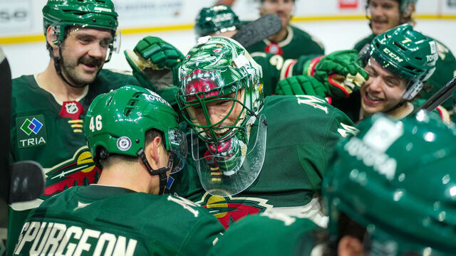 ST PAUL, MINNESOTA - APRIL 15: Marc-Andre Fleury #29 of the Minnesota Wild gets surrounded by teammates after an overtime win against the Anaheim Ducks at Xcel Energy Center on April 15, 2025 in St Paul, Minnesota.