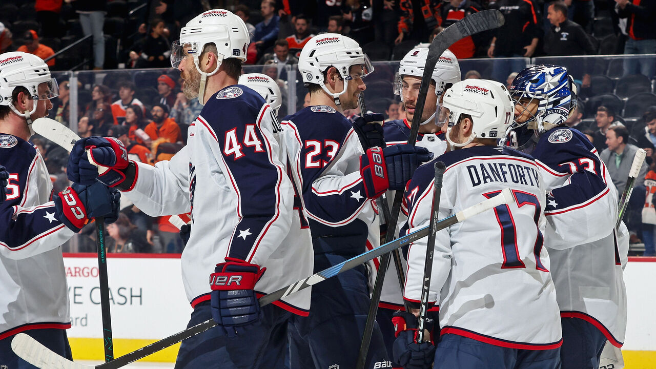 PHILADELPHIA, PENNSYLVANIA - APRIL 15: Members of the Columbus Blue Jackets celebrate after defeating the Philadelphia Flyers 3-0 at the Wells Fargo Center on April 15, 2025 in Philadelphia, Pennsylvania.
