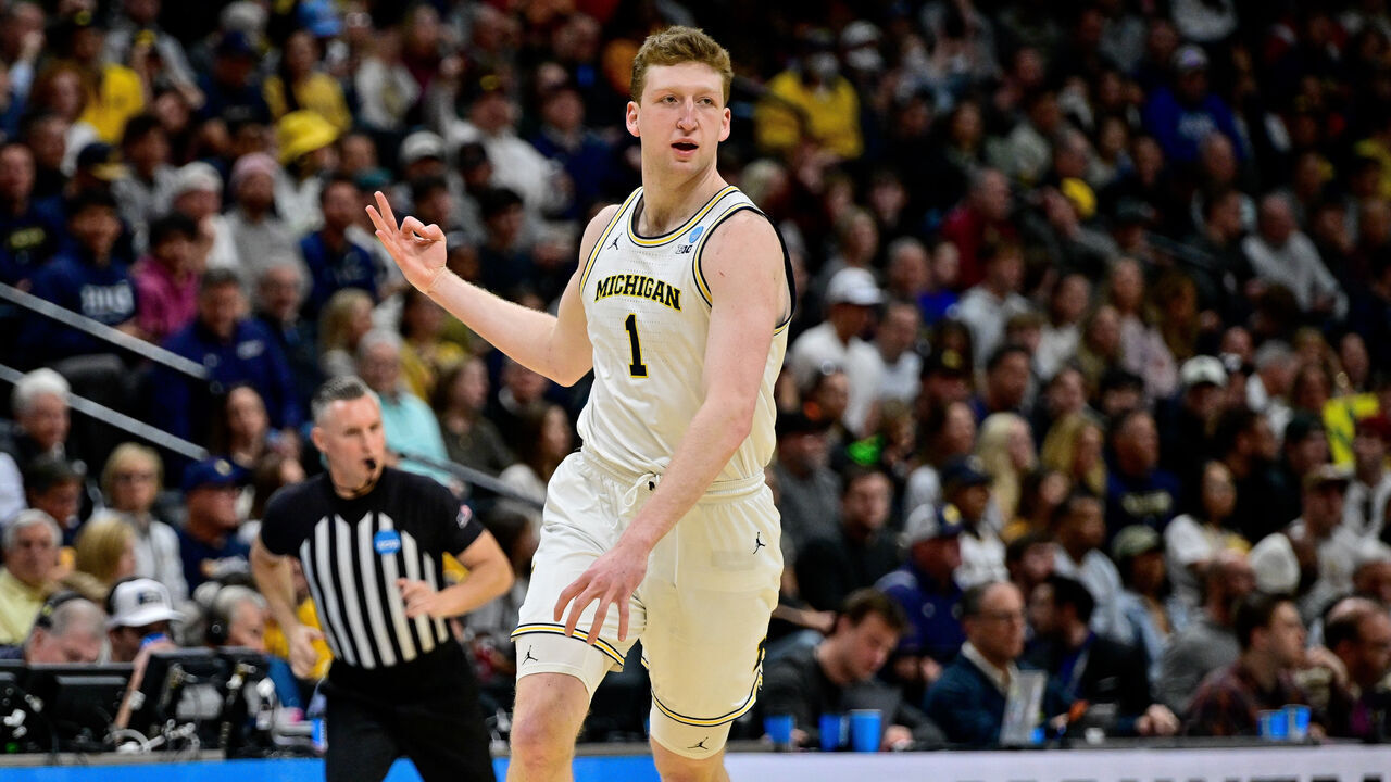 DENVER, COLORADO - MARCH 20: Danny Wolf #1 of the Michigan Wolverines celebrates after a first half three-point shot against the UC San Diego Tritons in the first round of the NCAA Men's Basketball Tournament at Ball Arena on March 20, 2025 in Denver, Colorado.