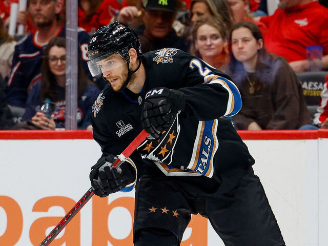 WASHINGTON, DC - APRIL 13: Nic Dowd #26 of the Washington Capitals makes a pass during a game against the Columbus Blue Jackets at Capital One Arena on April 13, 2025 in Washington, D.C.