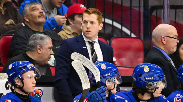 OTTAWA, CANADA - JANUARY 04: Head coach David Carle of Team USA handles bench duties in the first period against Team Czechia of the semifinal match during the 2025 IIHF World Junior Championship at Canadian Tire Centre on January 4, 2025 in Ottawa, Ontario, Canada. Team USA defeated Team Czechia 4-1 to secure a spot in the gold medal round.
