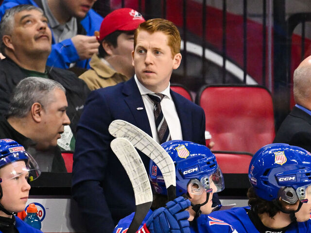 OTTAWA, CANADA - JANUARY 04: Head coach David Carle of Team USA handles bench duties in the first period against Team Czechia of the semifinal match during the 2025 IIHF World Junior Championship at Canadian Tire Centre on January 4, 2025 in Ottawa, Ontario, Canada. Team USA defeated Team Czechia 4-1 to secure a spot in the gold medal round.