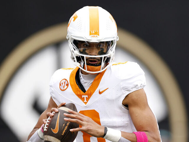 NASHVILLE, TENNESSEE - NOVEMBER 30: Nico Iamaleava #8 of the Tennessee Volunteers drops back to pass during the first half of the game between the Tennessee Volunteers and the Vanderbilt Commodores at FirstBank Stadium on November 30, 2024 in Nashville, Tennessee.