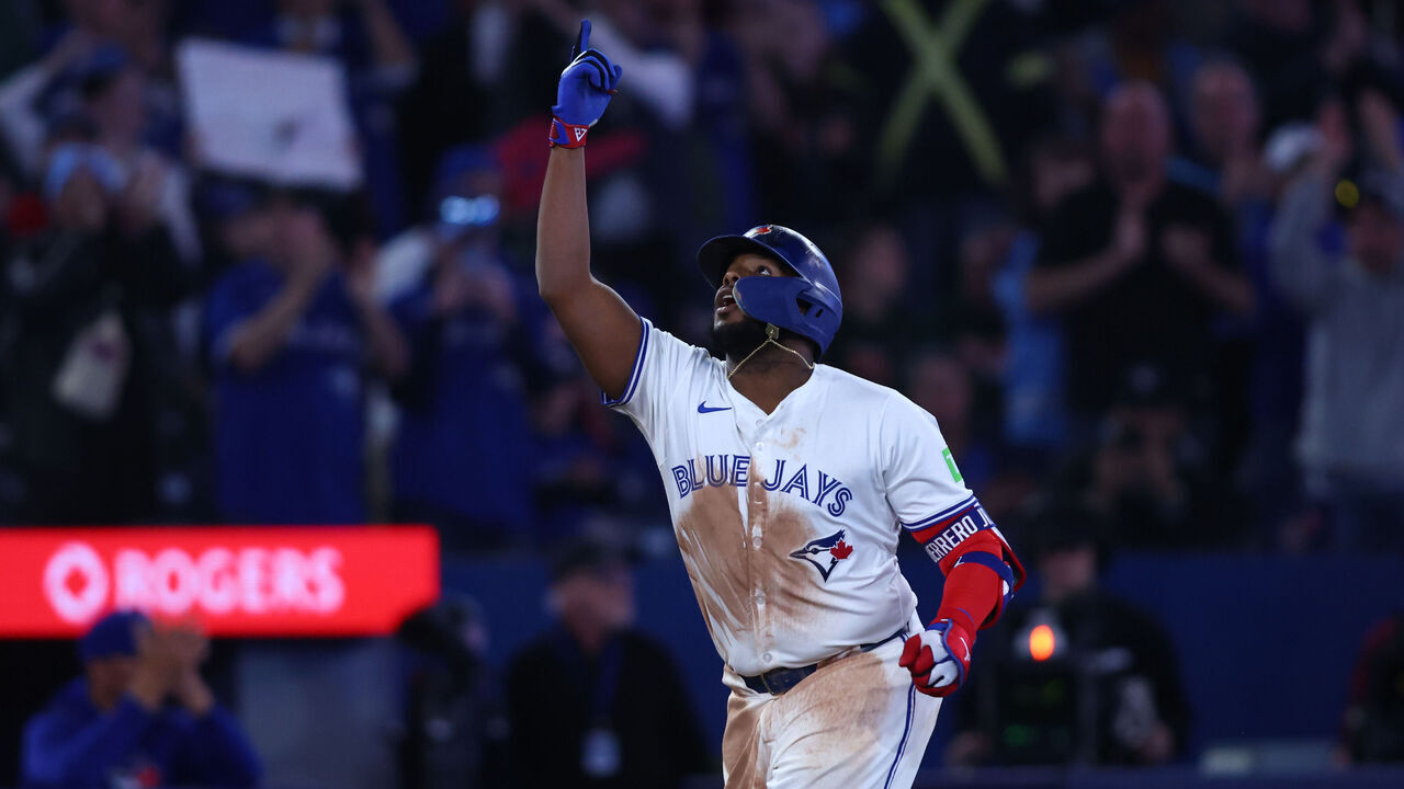 TORONTO, CANADA - APRIL 16: Vladimir Guerrero Jr. #27 of the Toronto Blue Jays celebrates as he rounds the bases on a home run in the sixth inning of their MLB game against the Atlanta Braves at Rogers Centre on April 16, 2025 in Toronto, Ontario, Canada.