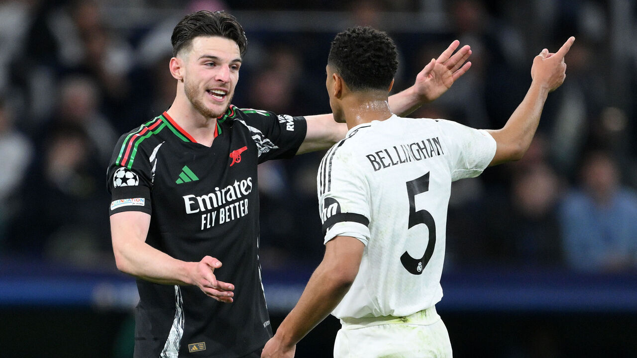 MADRID, SPAIN - APRIL 16: Declan Rice of Arsenal speaks to Jude Bellingham of Real Madrid during the UEFA Champions League 2024/25 Quarter Final Second Leg match between Real Madrid C.F. and Arsenal FC at Estadio Santiago Bernabeu on April 16, 2025 in Madrid, Spain.