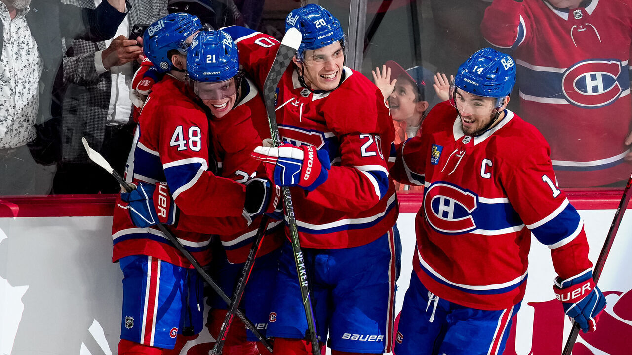 MONTREAL, QUEBEC - APRIL 16: Kaiden Guhle #21 of the Montreal Canadiens celebrates his goal with teammates Lane Hutson #48, Juraj Slafkovský #20 and Nick Suzuki #14 during the second period against the Carolina Hurricanes at Bell Centre on April 16, 2025 in Montreal, Quebec.