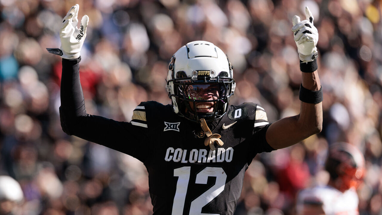 BOULDER, COLORADO - NOVEMBER 29: Travis Hunter #12 of the Colorado Buffaloes celebrates a touchdown during the third quarter against the Oklahoma State Cowboys at Folsom Field on November 29, 2024 in Boulder, Colorado.