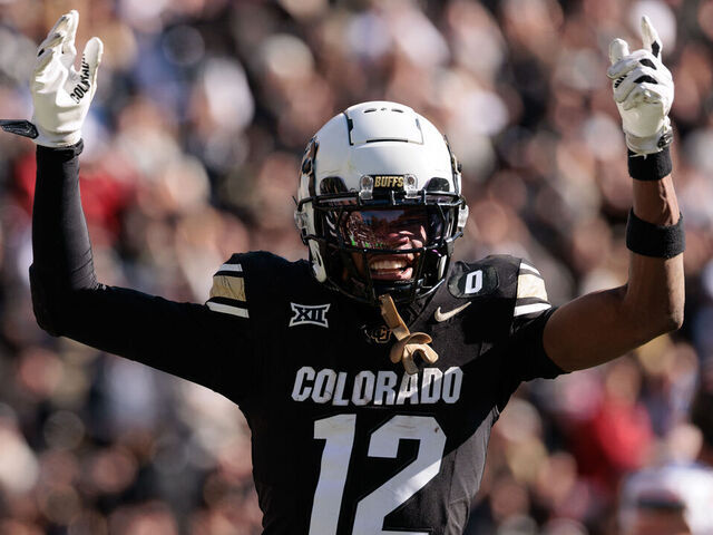 BOULDER, COLORADO - NOVEMBER 29: Travis Hunter #12 of the Colorado Buffaloes celebrates a touchdown during the third quarter against the Oklahoma State Cowboys at Folsom Field on November 29, 2024 in Boulder, Colorado.