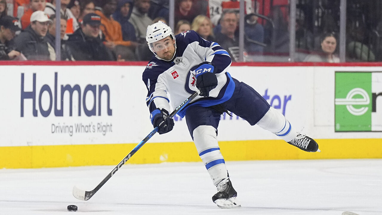 PHILADELPHIA, PENNSYLVANIA - MARCH 6: Neal Pionk #4 of the Winnipeg Jets controls the puck against the Philadelphia Flyers at the Wells Fargo Center on March 6, 2025 in Philadelphia, Pennsylvania. The Jets defeated the Flyers 4-1.