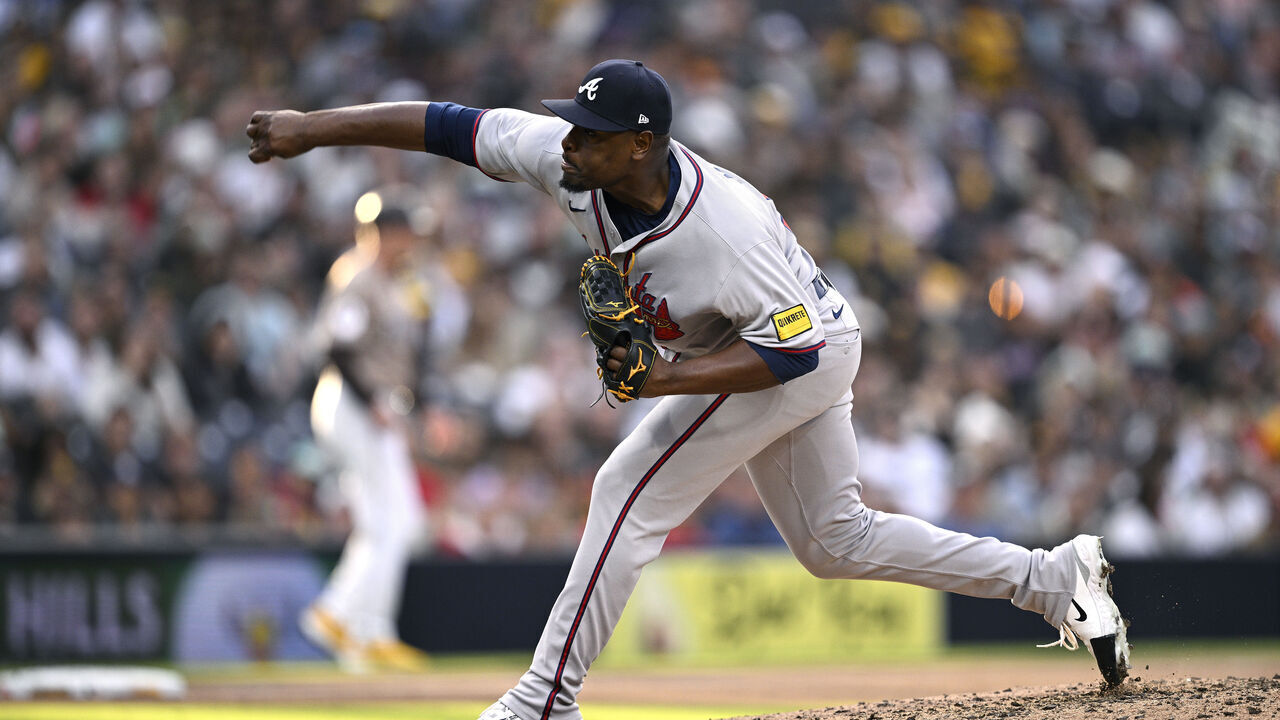 SAN DIEGO, CALIFORNIA - MARCH 30: Hector Neris #50 of the Atlanta Braves throws a pitch against the San Diego Padres during the eighth inning at Petco Park on March 30, 2025 in San Diego, California.