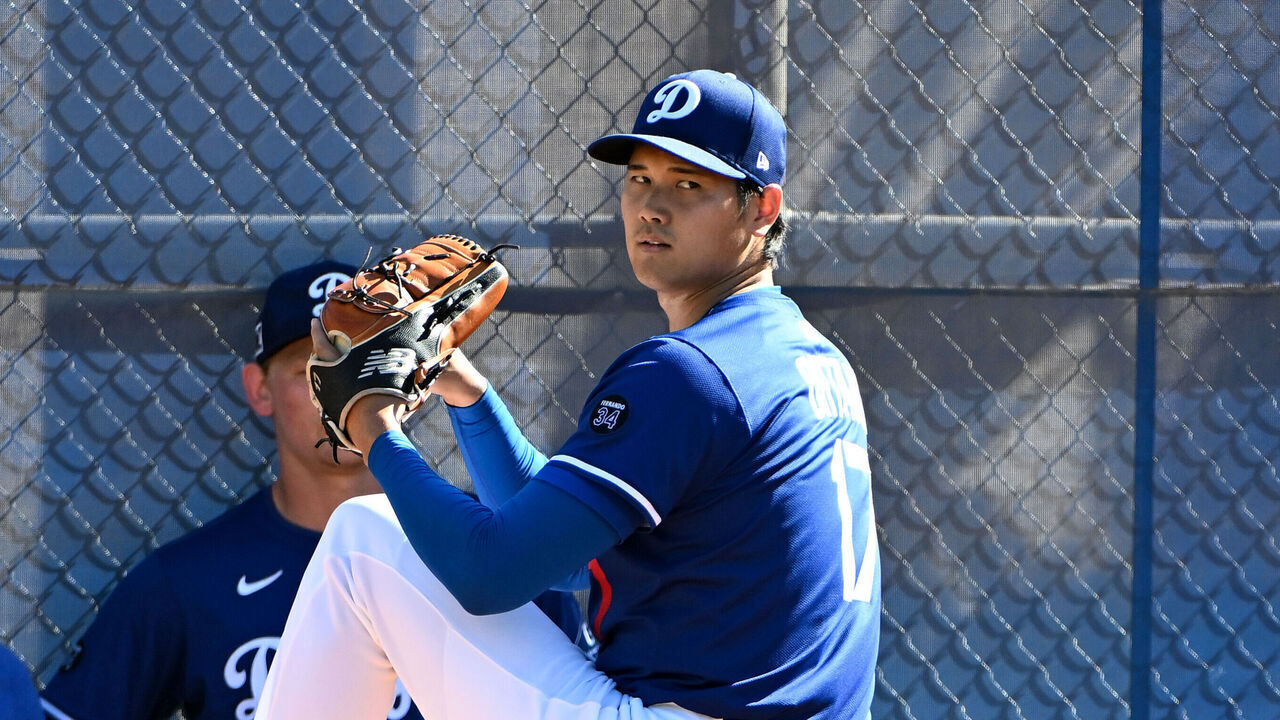 GLENDALE, ARIZONA - FEBRUARY 25, 2025: Shohei Ohtani #17 of the Los Angeles Dodgers throws a pitch during workouts at Camelback Ranch on February 25, 2025 in Glendale, Arizona.