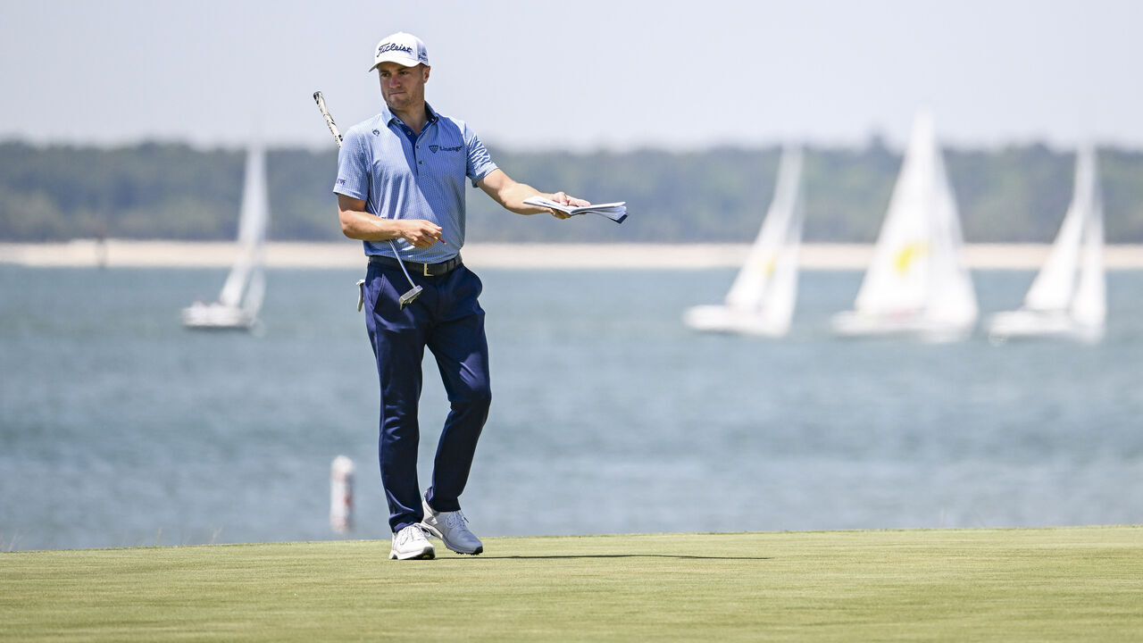 HILTON HEAD ISLAND, SOUTH CAROLINA - APRIL 17: Justin Thomas checks his yardage book on the 18th hole green during the first round of the RBC Heritage at Harbour Town Golf Links on April 17, 2025 in Hilton Head Island, South Carolina.
