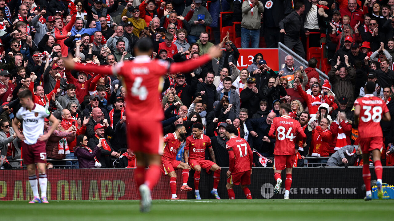 LIVERPOOL, ENGLAND - APRIL 13: Luis Diaz of Liverpool celebrates scoring his team's first goal with teammates Mohamed Salah and Curtis Jones during the Premier League match between Liverpool FC and West Ham United FC at Anfield on April 13, 2025 in Liverpool, England.