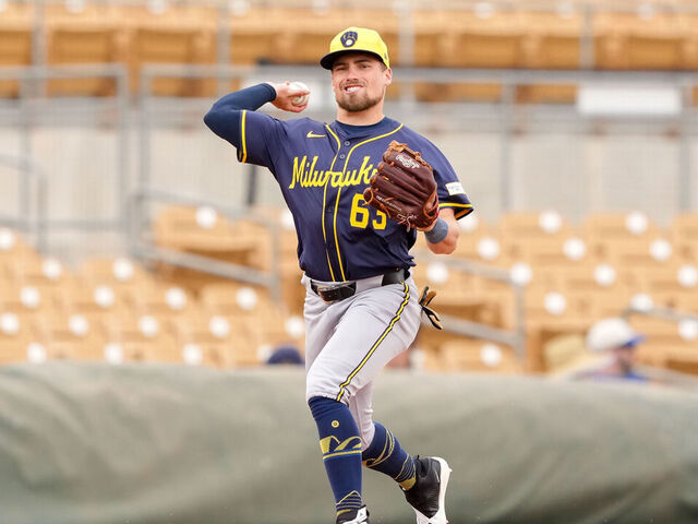 GLENDALE, ARIZONA - MARCH 13: Caleb Durbin #63 of the Milwaukee Brewers warms up between innings during a spring training game against the Chicago White Sox at Camelback Ranch on March 13, 2025 in Glendale, Arizona.