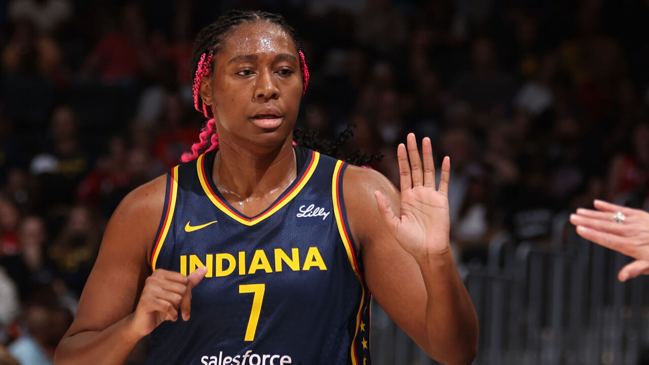 WASHINGTON, D.C. - SEPTEMBER 19: Aliyah Boston #7 of the Indiana Fever high fives a coach during the game against the Washington Mystics on September 19, 2024 at Entertainment and Sports Arena in Washington, D.C. Mandatory Copyright Notice: Copyright 2024 NBAE