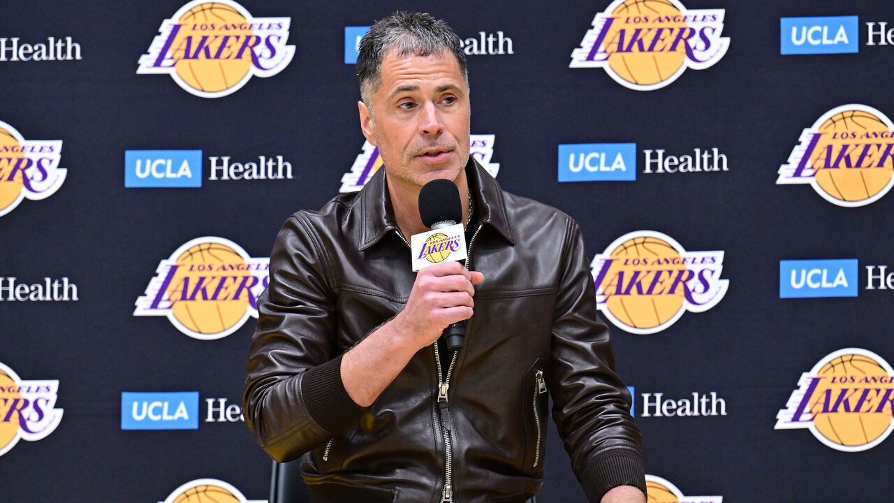 EL SEGUNDO, CA - FEBRUARY 04: Luka Doncic #77 of the Los Angeles Lakers is introduced by Rob Pelinka during a press conference on February 04, 2025 at UCLA Health Training Center in El Segundo, California. Mandatory Copyright Notice: Copyright 2025 NBAE