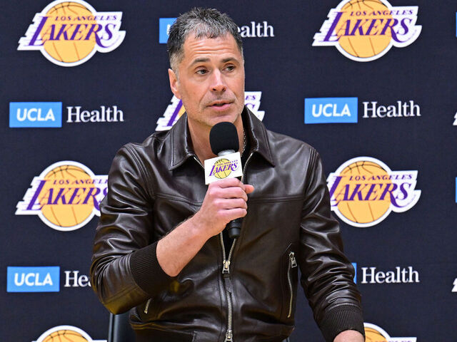 EL SEGUNDO, CA - FEBRUARY 04: Luka Doncic #77 of the Los Angeles Lakers is introduced by Rob Pelinka during a press conference on February 04, 2025 at UCLA Health Training Center in El Segundo, California. Mandatory Copyright Notice: Copyright 2025 NBAE