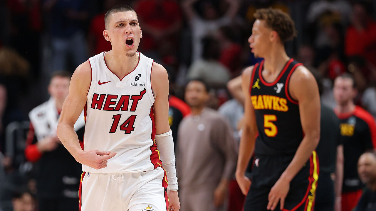 ATLANTA, GEORGIA - APRIL 18: Tyler Herro #14 of the Miami Heat reacts after a three-pointer against the Atlanta Hawks during overtime of an NBA play-in tournament game on April 18, 2025 in Atlanta, Georgia.