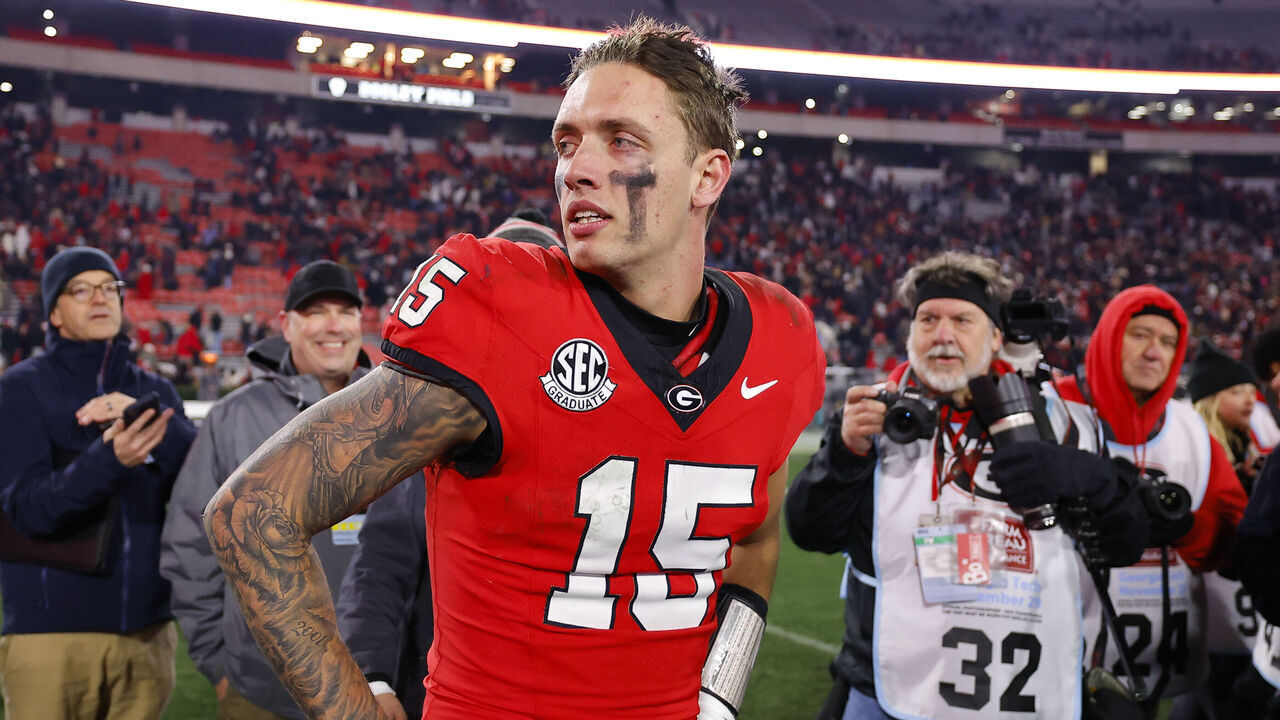 ATHENS, GEORGIA - NOVEMBER 29: Carson Beck #15 of the Georgia Bulldogs reacts following the 44-42 victory over the Georgia Tech Yellow Jackets in eighth overtime at Sanford Stadium on November 29, 2024 in Athens, Georgia.