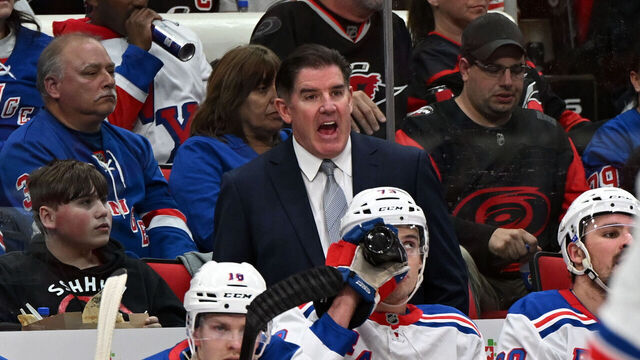 RALEIGH, NC - APRIL 12: New York Rangers head coach Peter Laviolette calls to officials during the NHL game between the New York Rangers and the Carolina Hurricanes on April 12, 2025 at Lenovo Center in Raleigh, North Carolina.