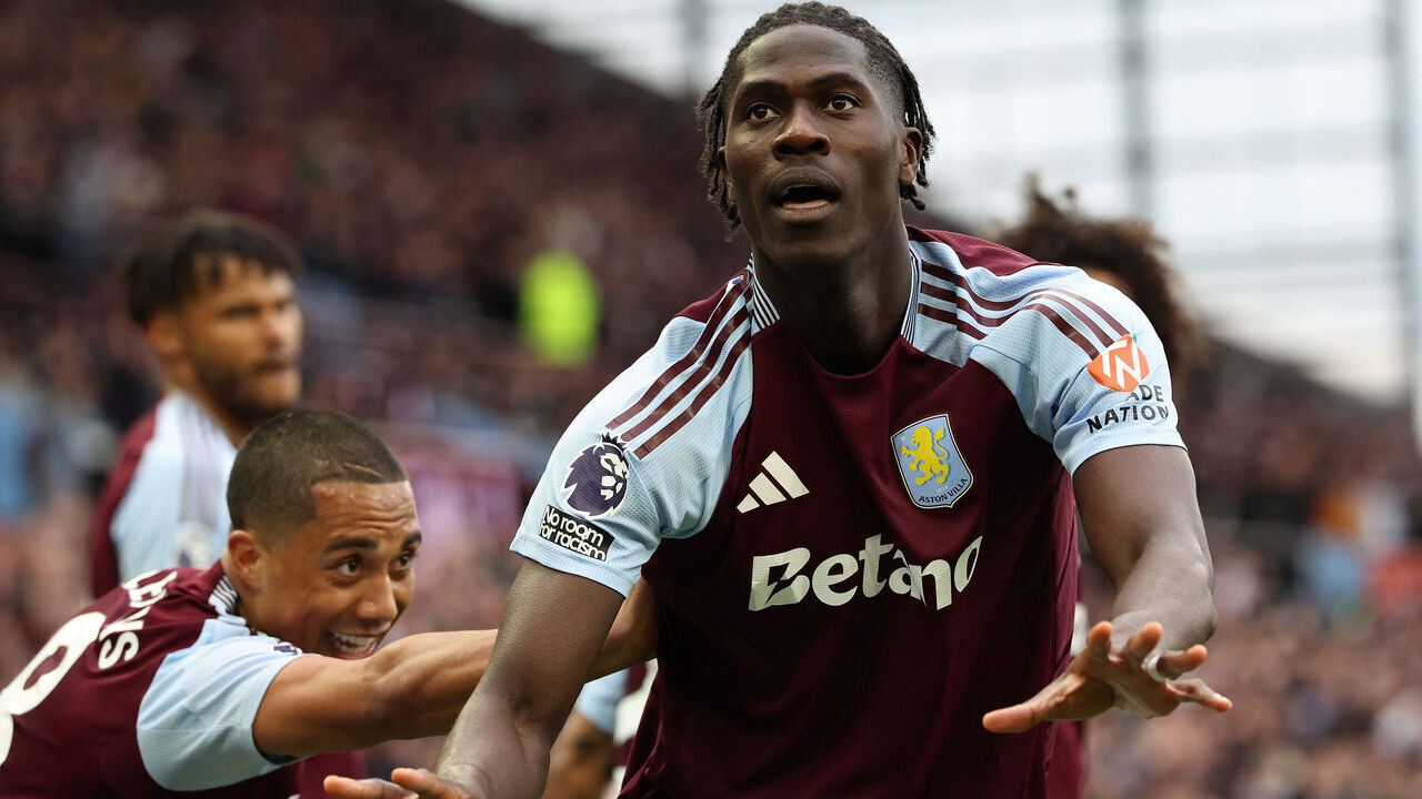 Aston Villa's Belgian defender #24 Amadou Onana (R) celebrates scoring the team's fourth goal during the English Premier League football match between Aston Villa and Newcastle United at Villa Park in Birmingham, central England on April 19, 2025.