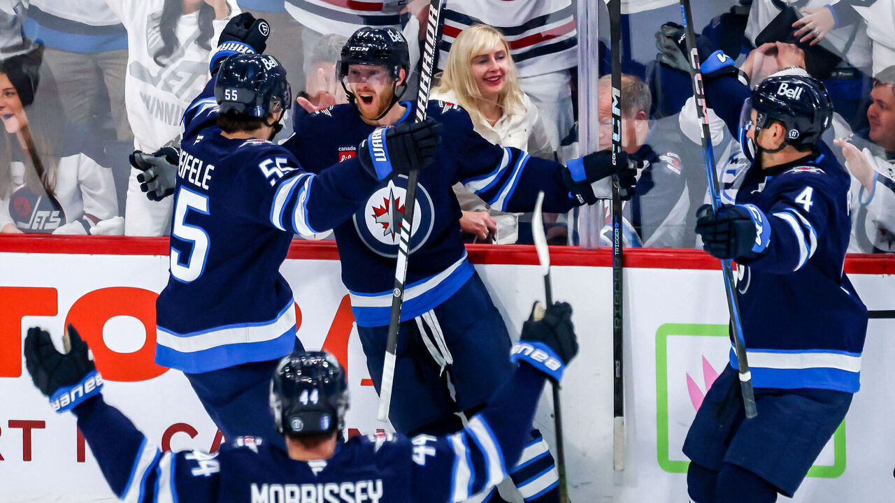 WINNIPEG, CANADA - APRIL 19: Kyle Connor #81 of the Winnipeg Jets celebrates his third period goal against the St. Louis Blues with teammates Mark Scheifele #55, Josh Morrissey #44 and Neal Pionk #4 in Game One of the First Round of the 2025 Stanley Cup Playoffs at the Canada Life Centre on April 19, 2025 in Winnipeg, Manitoba, Canada.