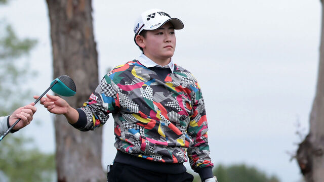 TARZANA, CALIFORNIA - APRIL 17: Akie Iwai of Japan hands a club to her cadde after playing her shot from the 11th tee during the first round of the JM Eagle LA Championship presented by Plastpro 2025 at El Caballero Country Club on April 17, 2025 in Tarzana, California.