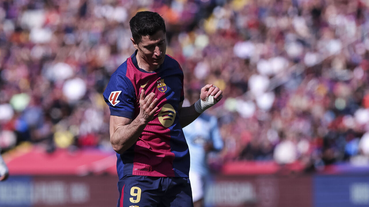 BARCELONA, SPAIN - APRIL 19: Robert Lewandowski of FC Barcelona laments during the La Liga EA Sports match between FC Barcelona and RC Celta at Estadi Olimpic Lluis Companys on April 19, 2025 in Barcelona, Spain.