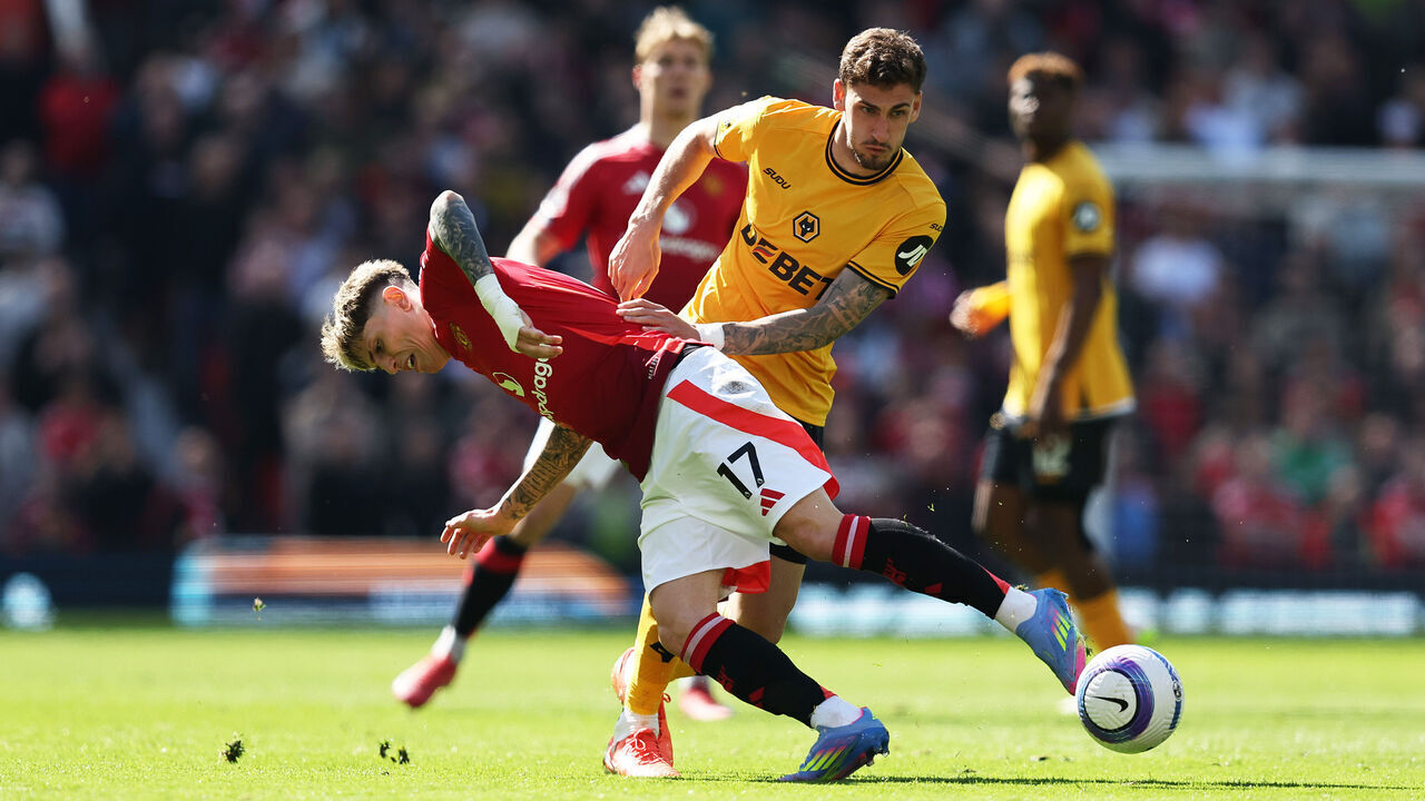 MANCHESTER, ENGLAND - APRIL 20: Alejandro Garnacho of Manchester United is challenged by Santiago Bueno of Wolverhampton Wanderers during the Premier League match between Manchester United FC and Wolverhampton Wanderers FC at Old Trafford on April 20, 2025 in Manchester, England.
