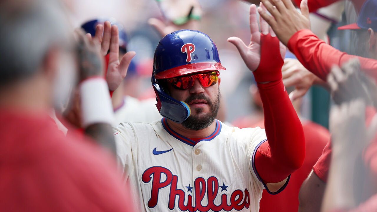 PHILADELPHIA, PENNSYLVANIA - APRIL 19: Kyle Schwarber #12 of the Philadelphia Phillies celebrates in the dugout after scoring on an RBI double by Max Kepler #17 in the third inning against the Miami Marlins at Citizens Bank Park on April 19, 2025 in Philadelphia, Pennsylvania.