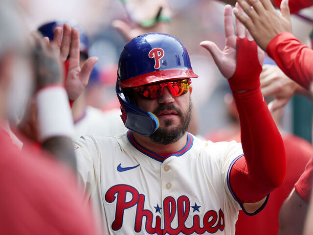 PHILADELPHIA, PENNSYLVANIA - APRIL 19: Kyle Schwarber #12 of the Philadelphia Phillies celebrates in the dugout after scoring on an RBI double by Max Kepler #17 in the third inning against the Miami Marlins at Citizens Bank Park on April 19, 2025 in Philadelphia, Pennsylvania.