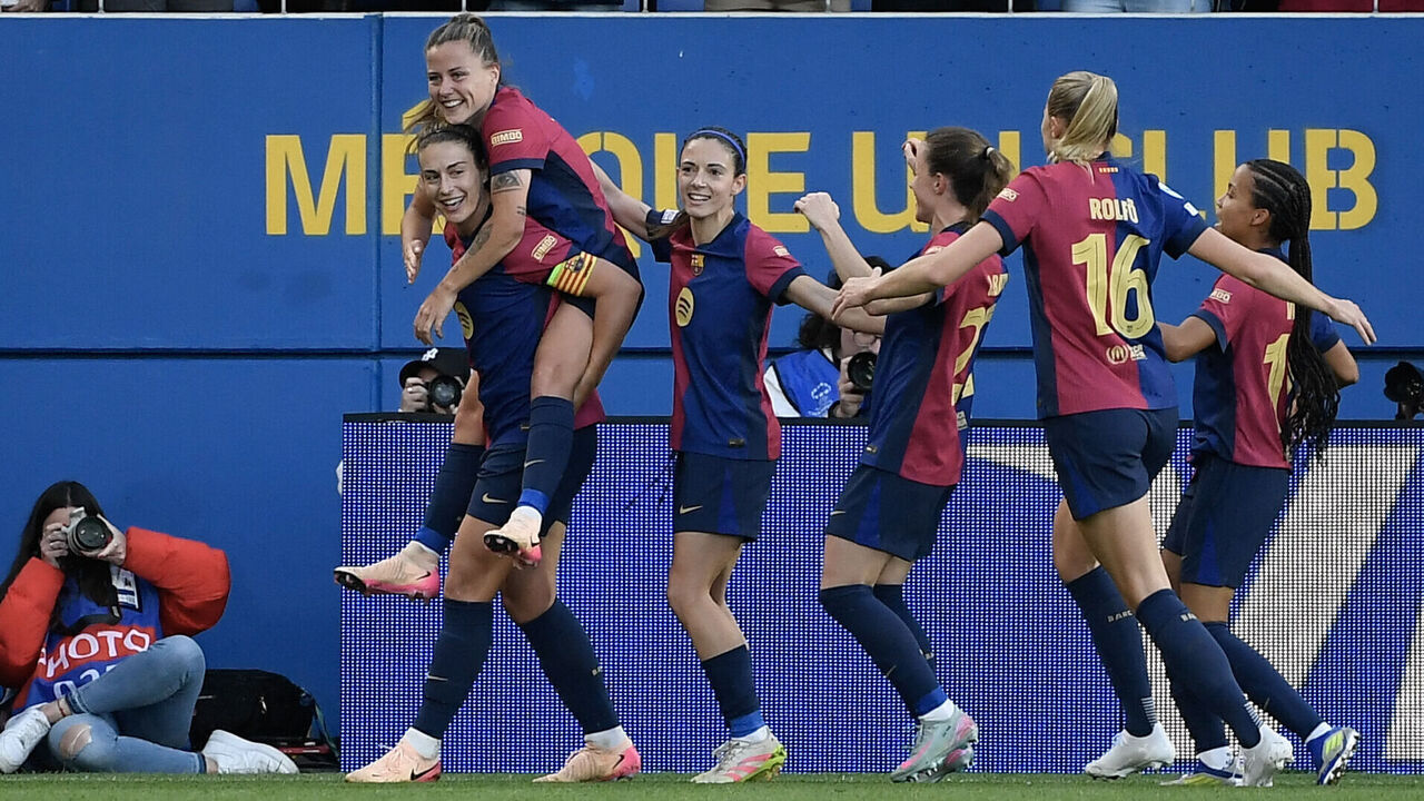Barcelona's Spanish forward #09 Claudia Pina (L) rides on a teammates shoulders as she celebrates scoring their fourth goal during the UEFA Women's Champions League semi-final first leg football match between FC Barcelona and Chelsea at the Johan Cruyff stadium in Barcelona, on April 20, 2025.