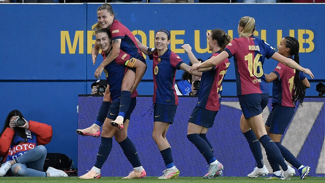 Barcelona's Spanish forward #09 Claudia Pina (L) rides on a teammates shoulders as she celebrates scoring their fourth goal during the UEFA Women's Champions League semi-final first leg football match between FC Barcelona and Chelsea at the Johan Cruyff stadium in Barcelona, on April 20, 2025.