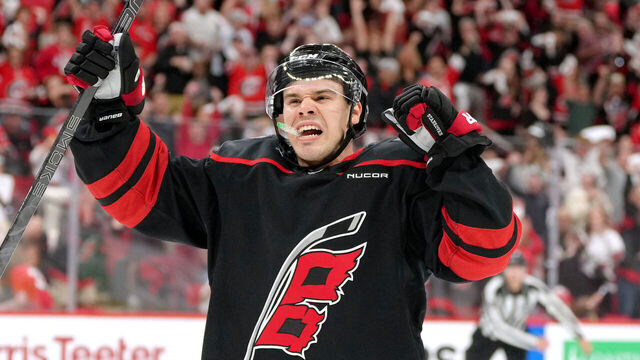 RALEIGH, NORTH CAROLINA - APRIL 20: Logan Stankoven #22 of the Carolina Hurricanes celebrates after scoring a goal against the New Jersey Devils in the second period of Game One of the First Round of the 2025 Stanley Cup Playoffs at Lenovo Center on April 20, 2025 in Raleigh, North Carolina.